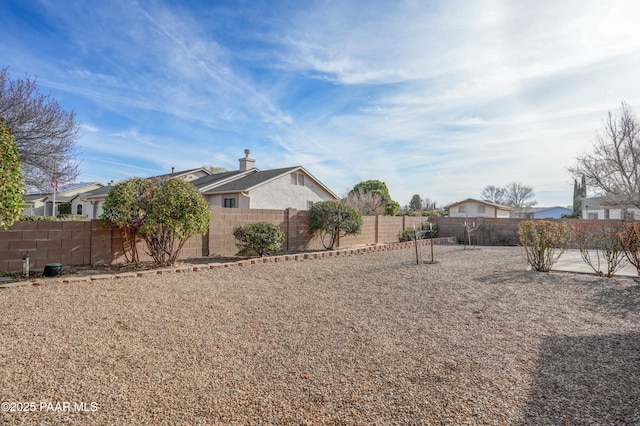 exterior space featuring a fenced backyard