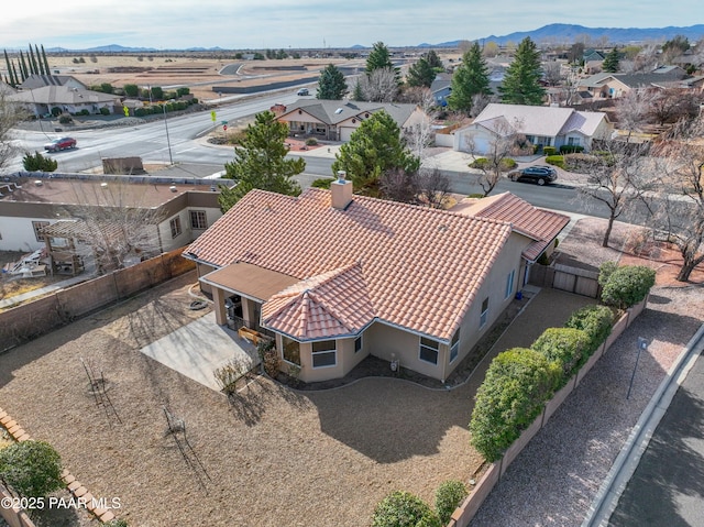 drone / aerial view featuring a mountain view and a residential view