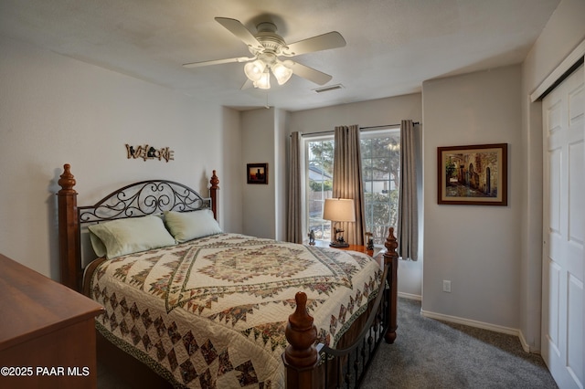 carpeted bedroom featuring baseboards, visible vents, and a ceiling fan