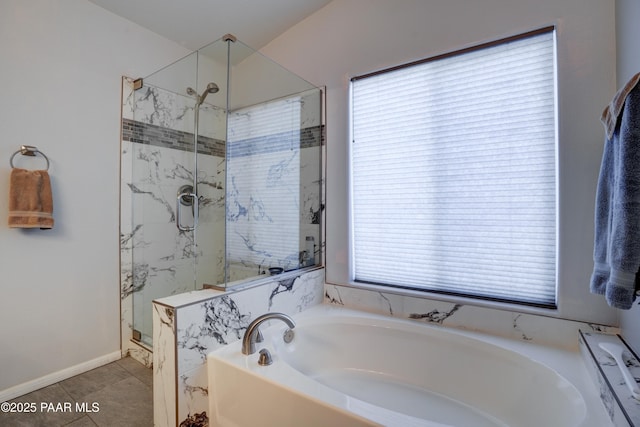 full bath with a stall shower, a garden tub, and tile patterned floors