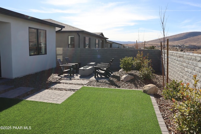 rear view of house with a lawn and a patio