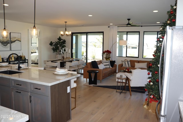 dining room featuring wood-type flooring and an inviting chandelier