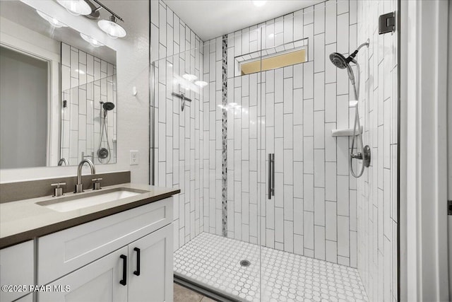 bathroom with vanity and walk in shower