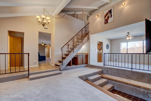 1086 N Broken Wagon Trl, Dewey-Humboldt, AZ 86327 - living area with carpet floors, a tile fireplace, and a ceiling fan