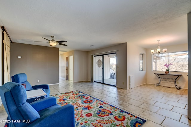 1086 N Broken Wagon Trl, Dewey-Humboldt, AZ 86327 - living area featuring radiator, plenty of natural light, a chandelier, light tile patterned flooring, and a textured ceiling