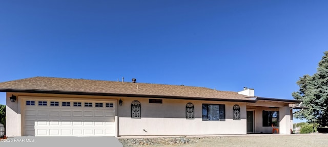 1086 N Broken Wagon Trl, Dewey-Humboldt, AZ 86327 - single story home featuring a garage, a chimney, concrete driveway, and stucco siding