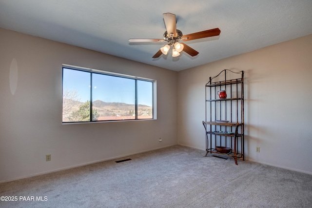1086 N Broken Wagon Trl, Dewey-Humboldt, AZ 86327 - carpeted empty room featuring ceiling fan and baseboards