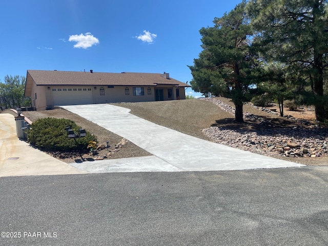 1086 N Broken Wagon Trl, Dewey-Humboldt, AZ 86327 - ranch-style house with driveway and an attached garage