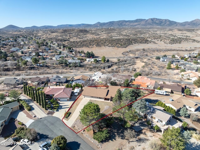 1086 N Broken Wagon Trl, Dewey-Humboldt, AZ 86327 - aerial perspective of suburban area with property parcel outlined, a mountain backdrop, and a desert landscape