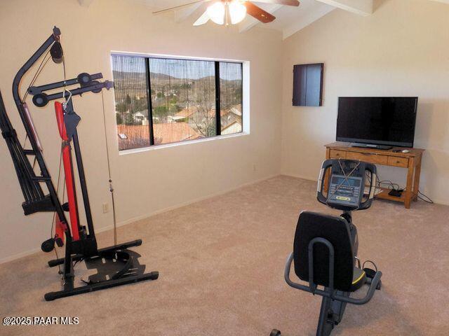 1086 N Broken Wagon Trl, Dewey-Humboldt, AZ 86327 - workout room with lofted ceiling, a ceiling fan, and carpet flooring