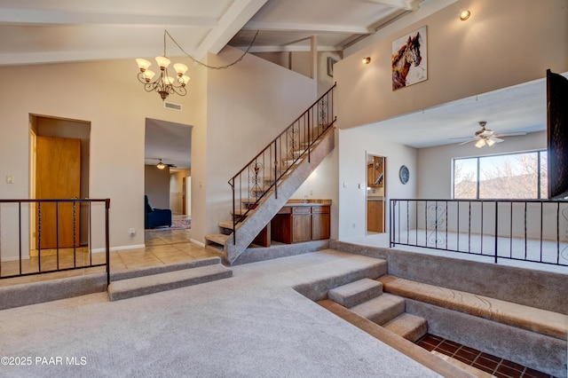 1086 N Broken Wagon Trl, Dewey-Humboldt, AZ 86327 - stairs with carpet flooring, ceiling fan, a chandelier, high vaulted ceiling, and beamed ceiling