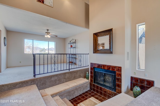 1086 N Broken Wagon Trl, Dewey-Humboldt, AZ 86327 - living area featuring carpet, a fireplace, and ceiling fan