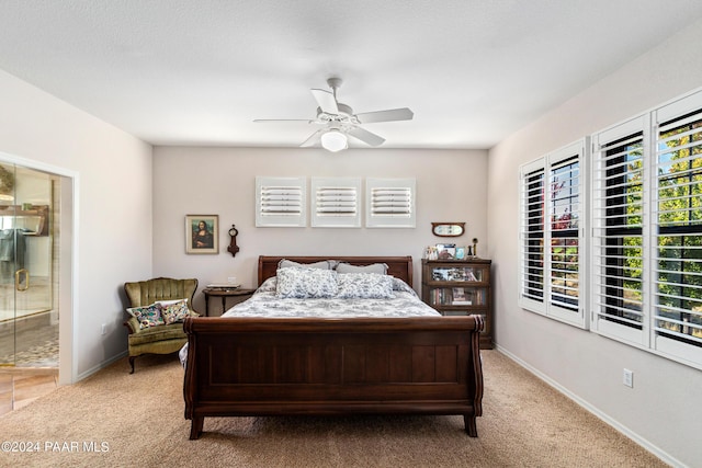 1716 Alpine Meadows Ln Unit 403, Prescott, AZ 86303 - bedroom featuring light carpet, connected bathroom, a ceiling fan, and baseboards