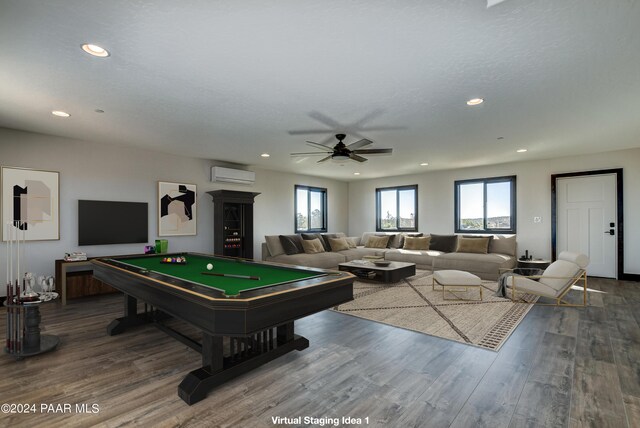 rec room with a wall unit AC, ceiling fan, hardwood / wood-style floors, and pool table