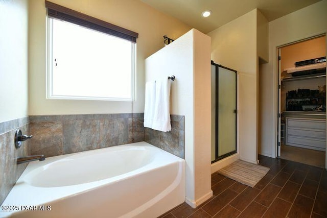 13085 E Ramos St, Dewey-Humboldt, AZ 86327 - bathroom with a bath, a stall shower, a spacious closet, recessed lighting, and wood finished floors