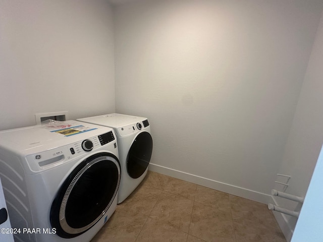 clothes washing area featuring independent washer and dryer