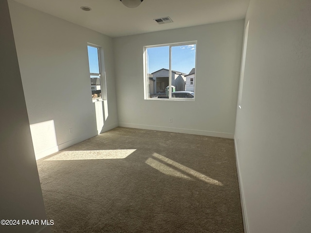 empty room with carpet flooring