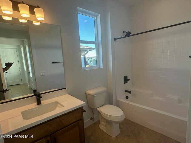 full bathroom with tile patterned flooring, vanity,  shower combination, and toilet