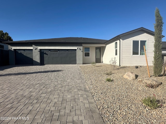 view of front of property with a garage