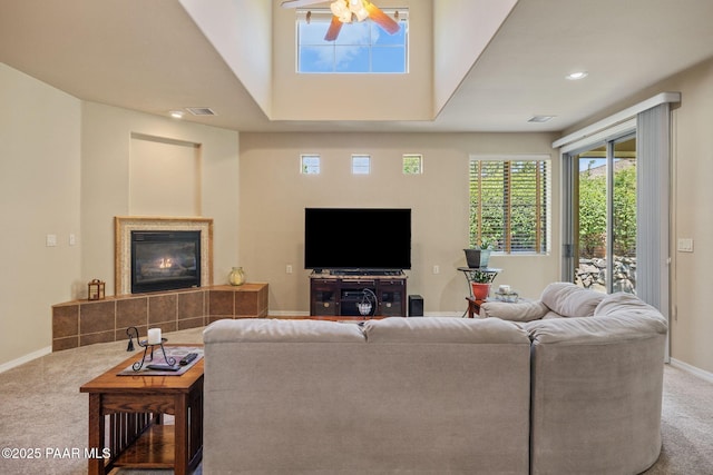 1222 Crown Ridge Dr, Prescott, AZ 86301 - carpeted living room featuring a ceiling fan, a tile fireplace, and recessed lighting