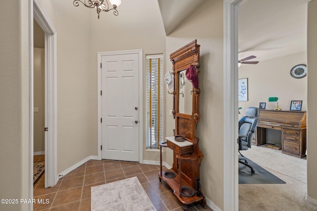 1222 Crown Ridge Dr, Prescott, AZ 86301 - foyer with tile patterned flooring, a ceiling fan, and a chandelier