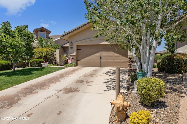 1222 Crown Ridge Dr, Prescott, AZ 86301 - view of property hidden behind natural elements featuring concrete driveway, stucco siding, an attached garage, and stone siding
