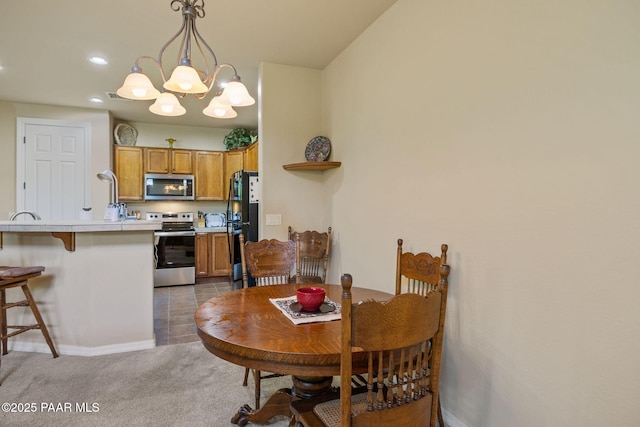 1222 Crown Ridge Dr, Prescott, AZ 86301 - dining room with a chandelier, recessed lighting, and light colored carpet