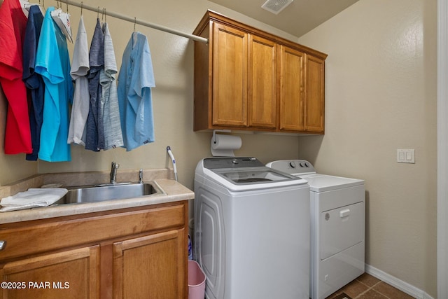 1222 Crown Ridge Dr, Prescott, AZ 86301 - laundry area featuring independent washer and dryer, cabinet space, and dark tile patterned flooring