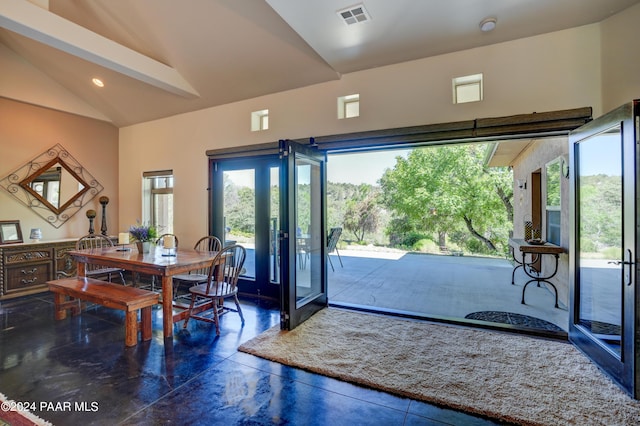 entryway featuring plenty of natural light and lofted ceiling