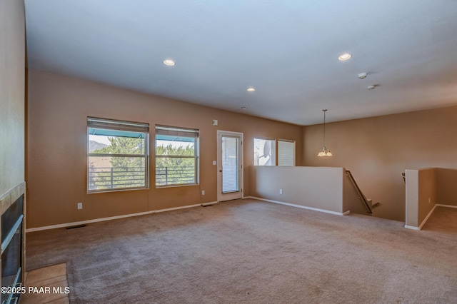 1005 N Rolling Green Rd, Dewey-Humboldt, AZ 86327 - unfurnished living room with a fireplace with flush hearth, carpet flooring, and recessed lighting