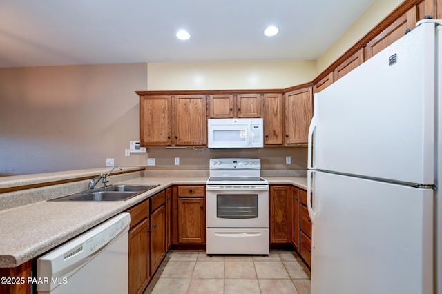 1005 N Rolling Green Rd, Dewey-Humboldt, AZ 86327 - kitchen featuring white appliances, brown cabinets, light tile patterned floors, light countertops, and recessed lighting