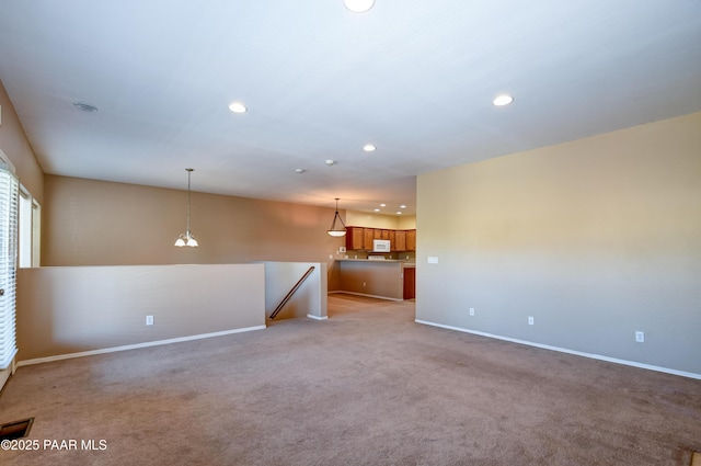 1005 N Rolling Green Rd, Dewey-Humboldt, AZ 86327 - unfurnished living room with recessed lighting and light carpet