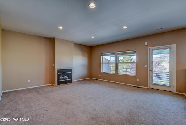 1005 N Rolling Green Rd, Dewey-Humboldt, AZ 86327 - unfurnished living room with a tile fireplace, recessed lighting, and carpet flooring