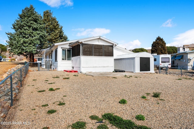 10157 Manzanita Trl, Dewey-Humboldt, AZ 86327 - manufactured / mobile home with a sunroom, an outdoor structure, fence, and a storage unit