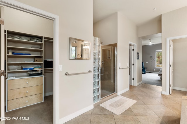2117 Colter Bay Ct, Prescott, AZ 86301 - full bath featuring a shower stall, a walk in closet, baseboards, a ceiling fan, and tile patterned flooring