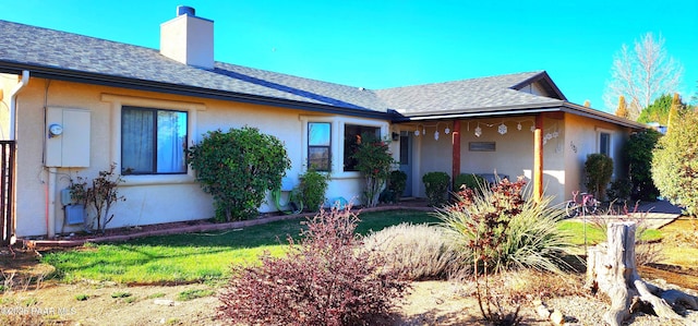 1125 N Wagon Wheel Pl, Chino Valley, AZ 86323 - view of front of property with a chimney, stucco siding, and a shingled roof