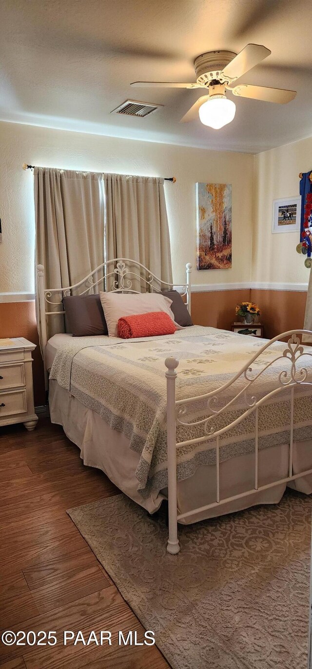 1125 N Wagon Wheel Pl, Chino Valley, AZ 86323 - bedroom with dark wood-type flooring and ceiling fan