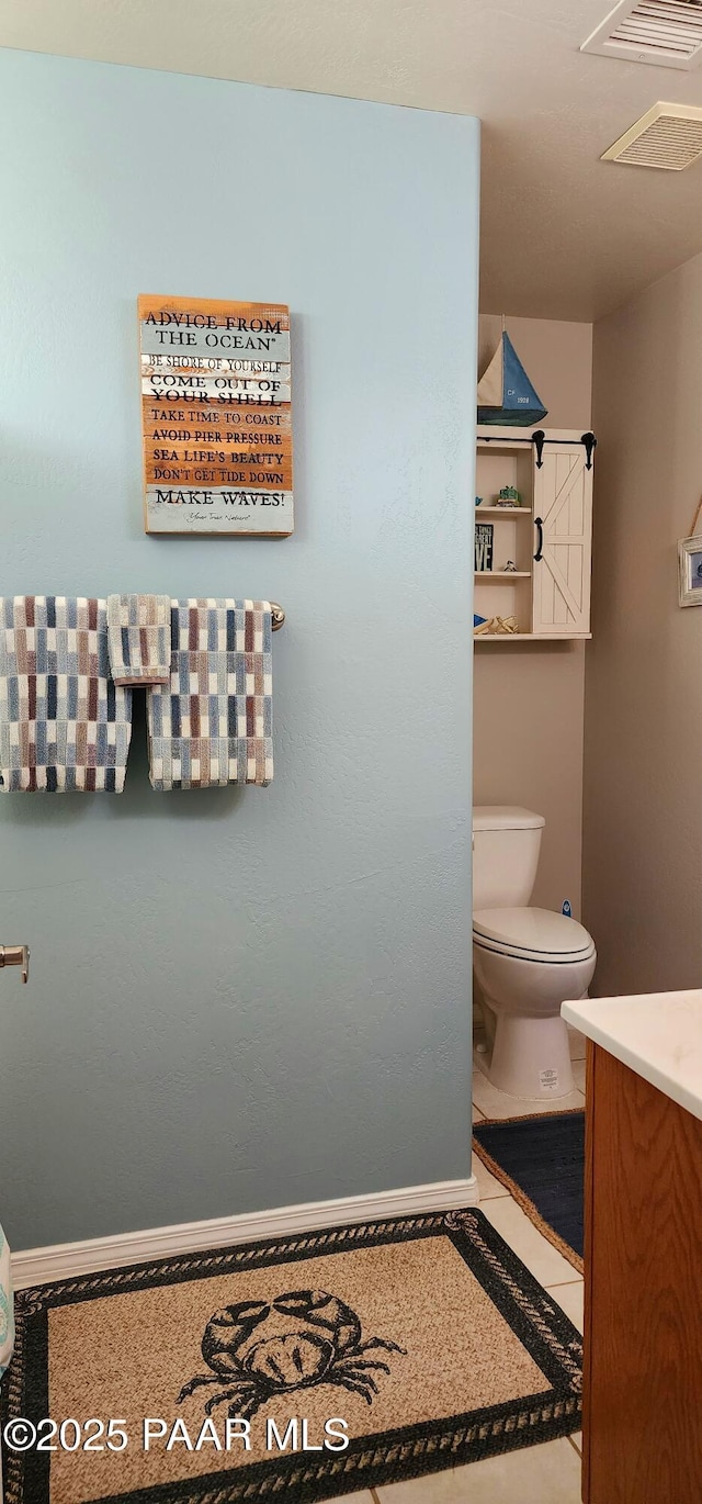 1125 N Wagon Wheel Pl, Chino Valley, AZ 86323 - bathroom featuring toilet, vanity, and baseboards
