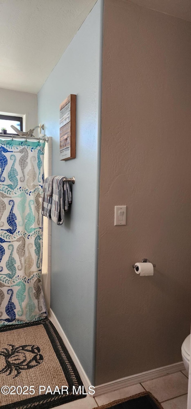 1125 N Wagon Wheel Pl, Chino Valley, AZ 86323 - full bathroom with toilet, a shower with curtain, baseboards, and tile patterned flooring
