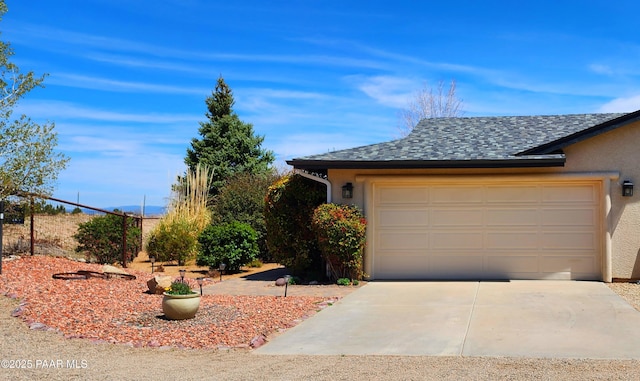 1125 N Wagon Wheel Pl, Chino Valley, AZ 86323 - view of front of house featuring stucco siding, concrete driveway, and roof with shingles