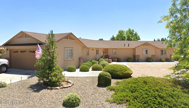 ranch-style home featuring a garage