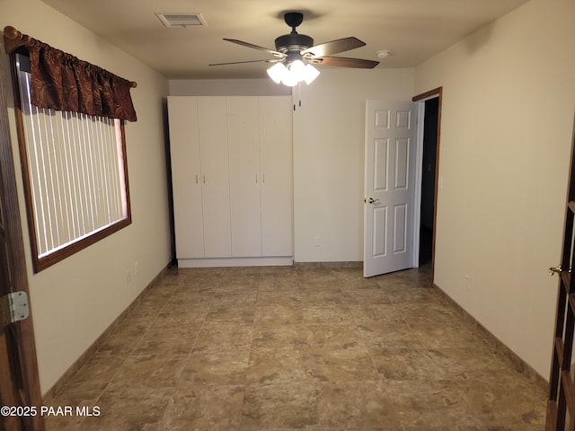 unfurnished bedroom with ceiling fan