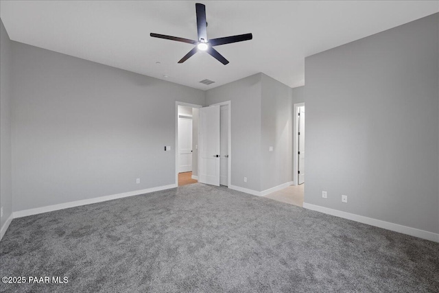 unfurnished bedroom featuring light colored carpet and ceiling fan