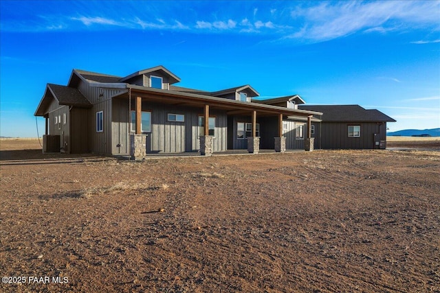 view of front of property with central AC and a porch