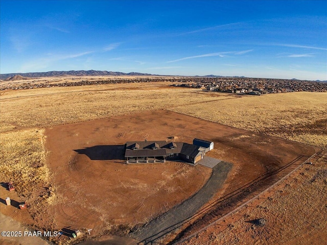 birds eye view of property featuring a mountain view