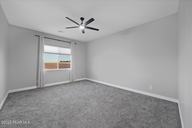 spare room with carpet flooring and ceiling fan