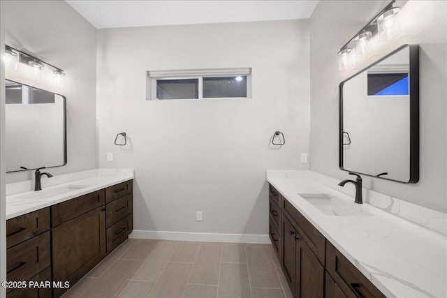 bathroom with tile patterned flooring and vanity