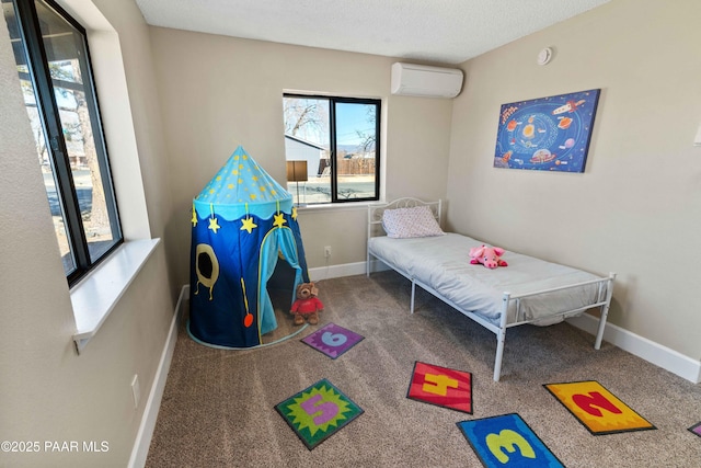 bedroom with carpet floors, a wall unit AC, and a textured ceiling