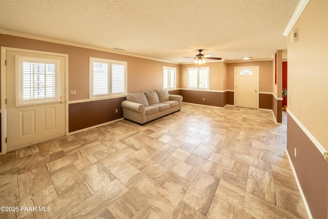 438 Jasmine Ln, Prescott, AZ 86301 - living room featuring plenty of natural light, crown molding, a textured ceiling, ceiling fan, and baseboards