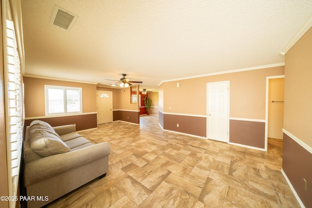 438 Jasmine Ln, Prescott, AZ 86301 - living area featuring a ceiling fan, ornamental molding, a textured ceiling, and baseboards